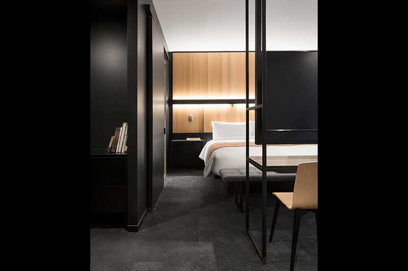 Hotel Room With Black And Wood Accents
