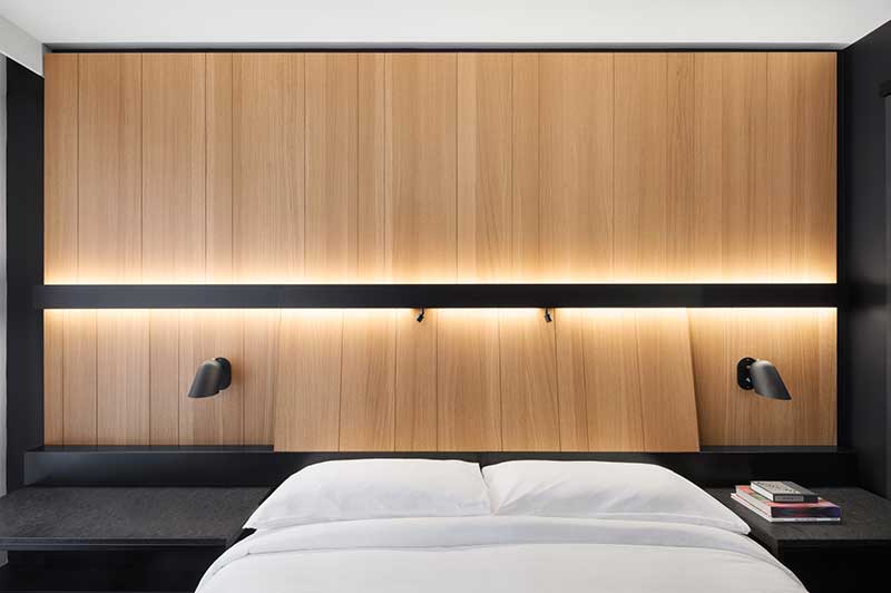 Hotel Room With Black And Wood Decor